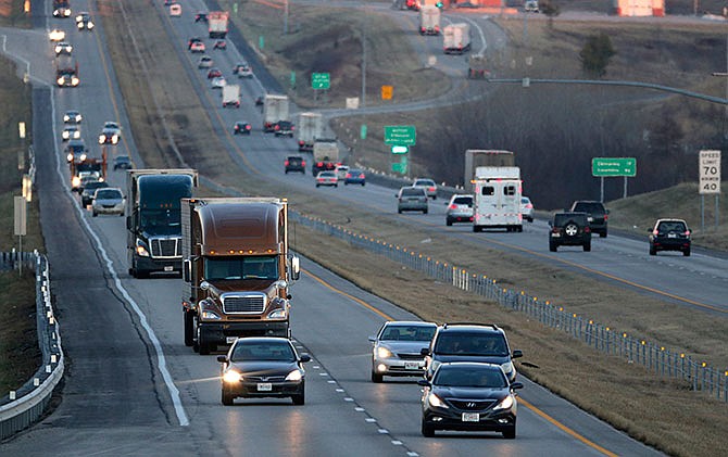 In this Thursday, Jan. 14, 2016 photo, vehicles travel along Interstate 70 near Odessa, Mo. 