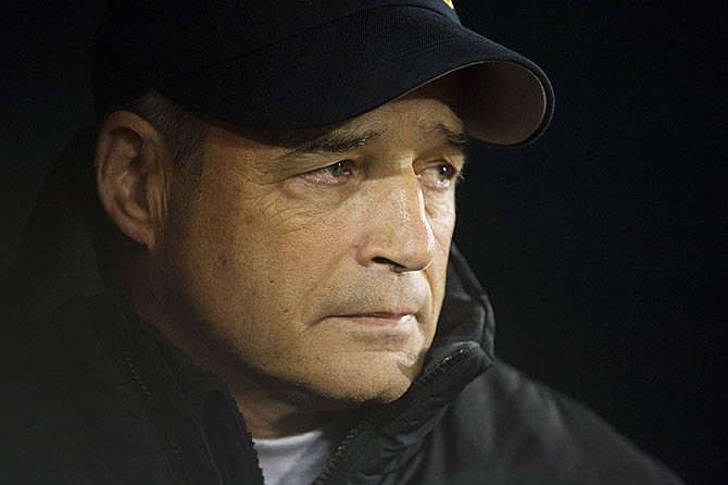 In this Nov. 21, 2015, photo, former Missouri head coach Gary Pinkel stands on the sideline before the start of an NCAA college football game against Tennessee in Columbia, Mo. It was his last home game as head coach of Missouri. Pinkel retiried after being diagnosed with non-Hodgkin lymphoma earlier in 2015. He will remain at the university as a fundraiser and ambassador, earning nearly $1 million over the length of a 3-year contract.