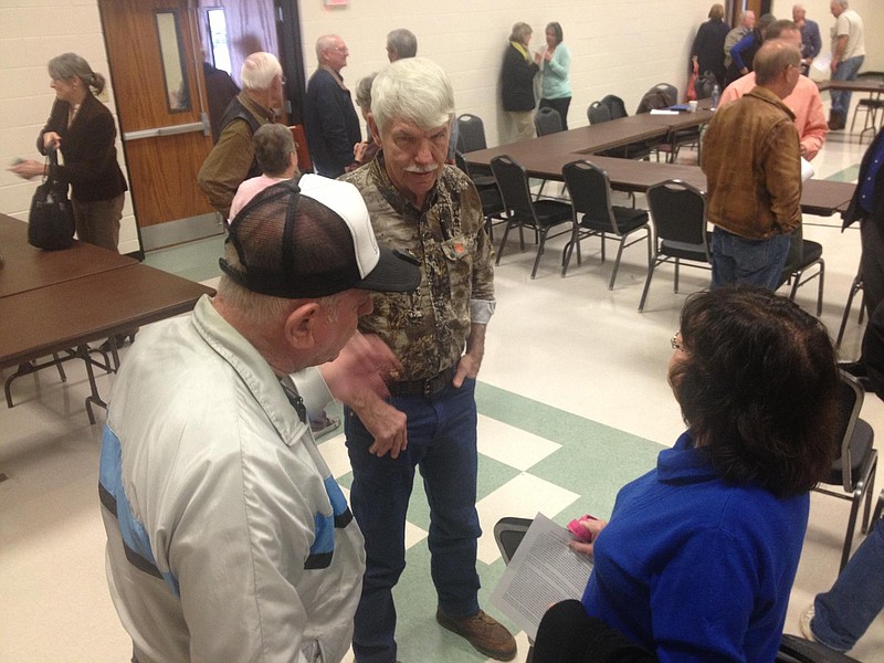 Jimmy Hair, left, a citizen of Van Zandt County, speaks to John Bradley, who represents Marion County on the Region D Water Planning Group, and Delores McCright, retired Texarkana College biology professor, after the Region D meeting Wednesday. McCright raised questions regarding the effectiveness of the Sulphur River Basin Authority, which represents eight counties, including Bowie.