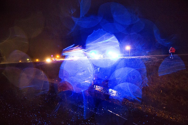 Arkansas State police and other first responders work the scene of a fatal train accident at the Pine Street crossing Thursday night, Jan. 21, 2016, in Ogden, Ark. Two people were killed and a third was seriously injured.