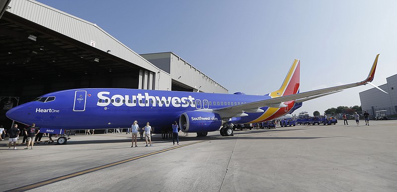 A Southwest Airlines plane sits outside a hangar Sept. 8, 2014, at Love Field in Dallas.