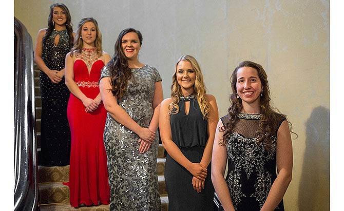 Queen Megan Foster, front, stands with court members, from right, Blair Michael, Mara Bush, Savannah Bopp, and Jayme Baumgartner at the Governor's Mansion.