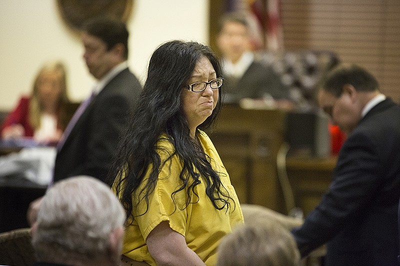 Tracie Dierks, 41, makes eye contact with relatives Tuesday, Jan. 26. 2016, morning as she leaves the Little River County courtroom. Dierks was arrested in connection with the fatal shooting of Caitlin Caskey, 17, at a birthday party Saturday in the Wallace community.