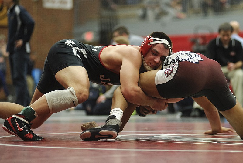 Jacob Brune of Jefferson City works toward a cradle during his match with Park Hill's Devin Winston in their 160-pound match earlier this month in the Capital City Invitational at Fleming Fieldhouse.