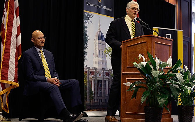 University of Missouri interim chancellor Hank Foley delivers the State of the University address as interim University of Missouri system president Michael Middleton, left, listens Wednesday, Jan. 27, 2016, in Columbia, Mo. 