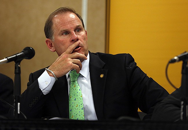 In this April 11, 2014 file photo, Tim Wolfe, then University of Missouri president, listens during a university news conference in Rolla, Mo.