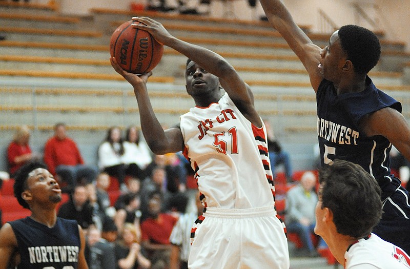 Garrett Parker of Jefferson City goes up for a shot during Friday night's game against Transportation and Law at Fleming Fieldhouse. 