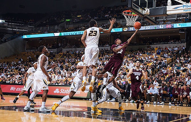 Mississippi State's Craig Sword (32) shoots as he drives past the Missouri defense during the second half of an NCAA college basketball game, Saturday, Jan. 30, 2016, in Columbia, Mo. Mississippi State won the game 76-62. 