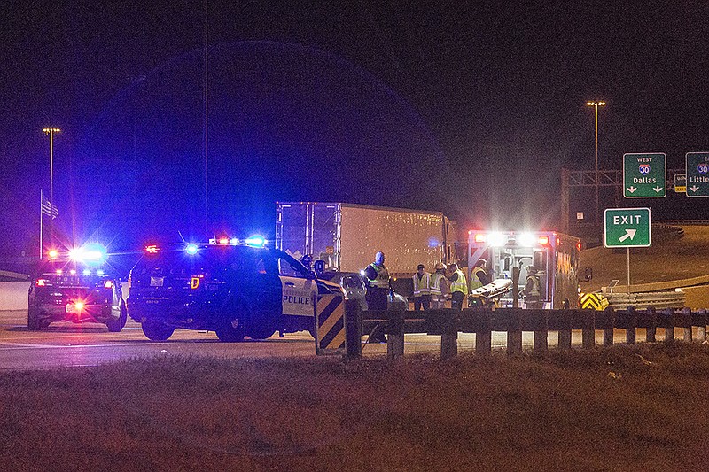 Emergency responders unload a stretcher Saturday, Jan. 30, 2016 from an ambulance to aid John Hall, 18, of Texarkana, Texas, after a head-on collision with a guardrail on Interstate 30 Highway near Jarvis Parkway, according to police. About 8:30 p.m., Hall was driving a gray, 2009 Chevy Malibu northbound on the highway when he passed out from what police said was an underlying medical condition before striking the rail. Authorities said he was unresponsive but breathing when help arrived. Hall was taken to CHRISTUS St. Michael's Hospital for treatment of minor injuries sustained in the crash.