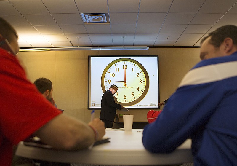 Region II  high school coaches and athletic directors make last-minute negotiations Monday morning in Mount Pleasant before the University Interscholastic League (UIL) realignment was announced. This realignment governs Texas schools on what team are in district for athletic competitions.