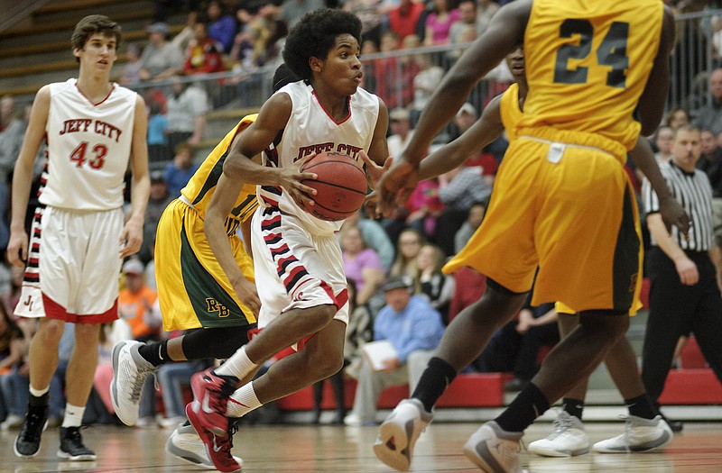 Chuck Cooper of Jefferson City drives toward the lane during Tuesday night's game against Rock Bridge at Fleming Fieldhouse.