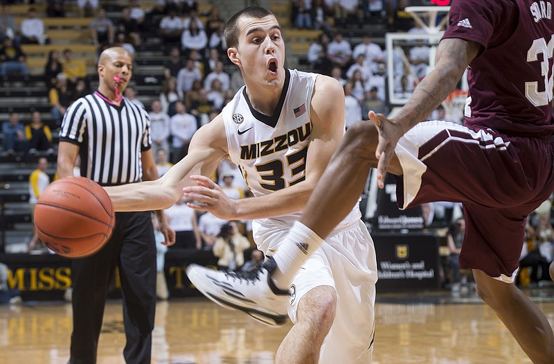 Cullen VanLeer of Missouri passes the ball around a Mississippi State defender during Saturday's game at Mizzou Arena.