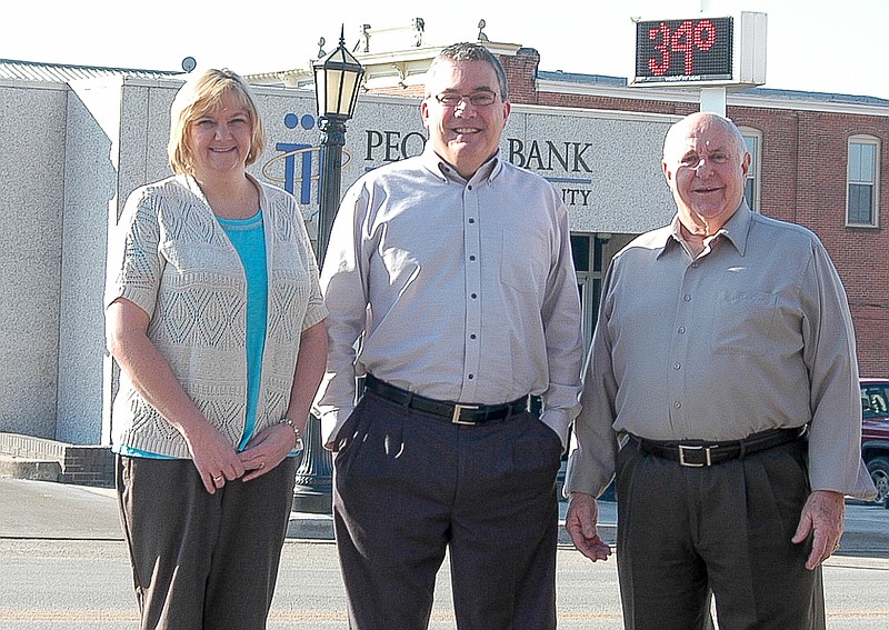 Gary Miller, center, new California Branch Peoples Bank loan officer, with California Branch Vice President Shelly Hampton, left, and Peoples Bank President David Hampton, right.