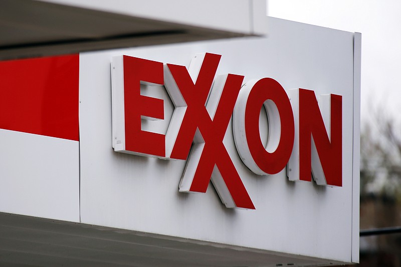 This April 29, 2014, file photo, shows an Exxon sign at a Exxon gas station in Carnegie, Pa. Exxon Mobil Corp. reports quarterly financial results on Tuesday, Feb. 2, 2016. 