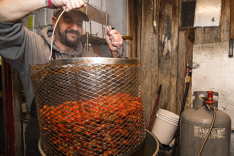 Clint Nixon demonstrates on Thursday, Feb. 4, 2016, how he will cook crawfish for Mardi Gras celebrations Saturday at Fat Jack's. He cooks 25 pounds of crawfish at a time a few times a night at Fat Jack's, and he will cook 400 pounds at Saturday's event.