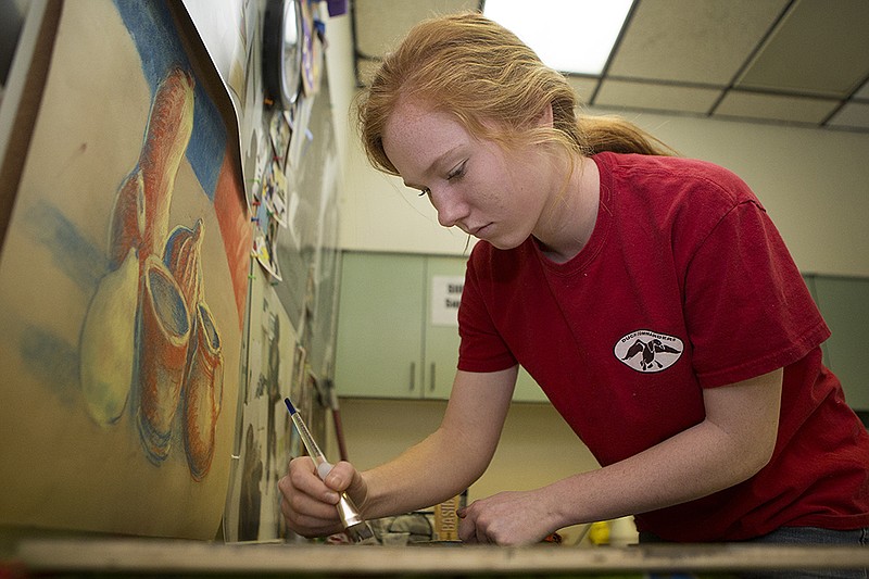 Redwater High School freshman Maddie Lee works on her mixed-media piece "What Are the Things That Are Holding You Back From Doing What You Really Want To Do"  on Thursday Feb. 4, 2016 at Arts on Main in downtown Texarkana. Lee and her classmates are getting ready for the Visual Arts Scholastic Events competition on Feb. 27 at Pleasant Grove High School. Redwater rented the space for one day to give its art students a quiet place to focus on their work.  