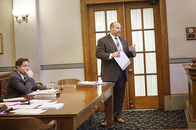 Assistant Attorney General Andrew Hirth, right, argues on the side of the State of Missouri during a case brought about by the city of Normandy in protest of last year's Municipal Courts Reform Law. St. Louis Attorney Sam Alton, seated, appeared in favor of the plaintiff.