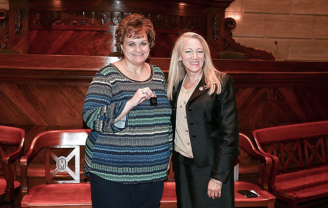 Polly Clark, left, a Missouri Senate Research secretary, was presented a 25-year service pin by state Sen. Jeanie Riddle, R-Callaway County.