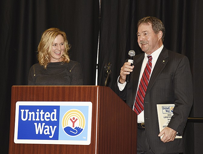 Ken Littlefield, right, accepts the Live United Award on behalf of his wife, Ann Littlefield, who was not present at Friday's luncheon. Ann and Claudia Kehoe, left, were co-winners of the high honor at the annual United Way annual meeting for their work on the Buddy Pack Program. 