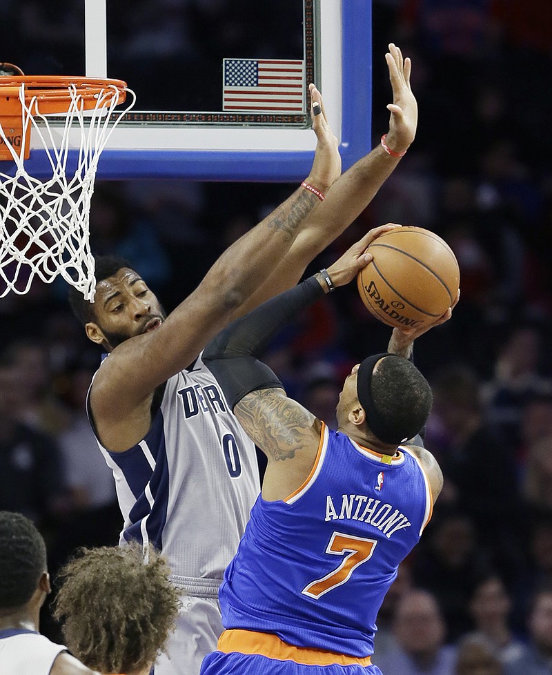 New York Knicks forward Carmelo Anthony (7) shoots over the defense of Detroit Pistons center Andre Drummond (0) during the first half of an NBA basketball game, Thursday, Feb. 4, 2016 in Auburn Hills, Mich. 