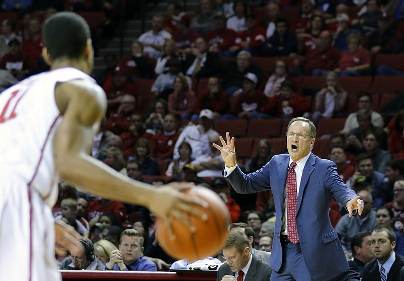 Oklahoma head coach Lon Kruger gives instructions guard Isaiah Cousins (11) during the first half of an NCAA college basketball game against TCU in Norman, Okla., Tuesday, Feb. 2, 2016. 