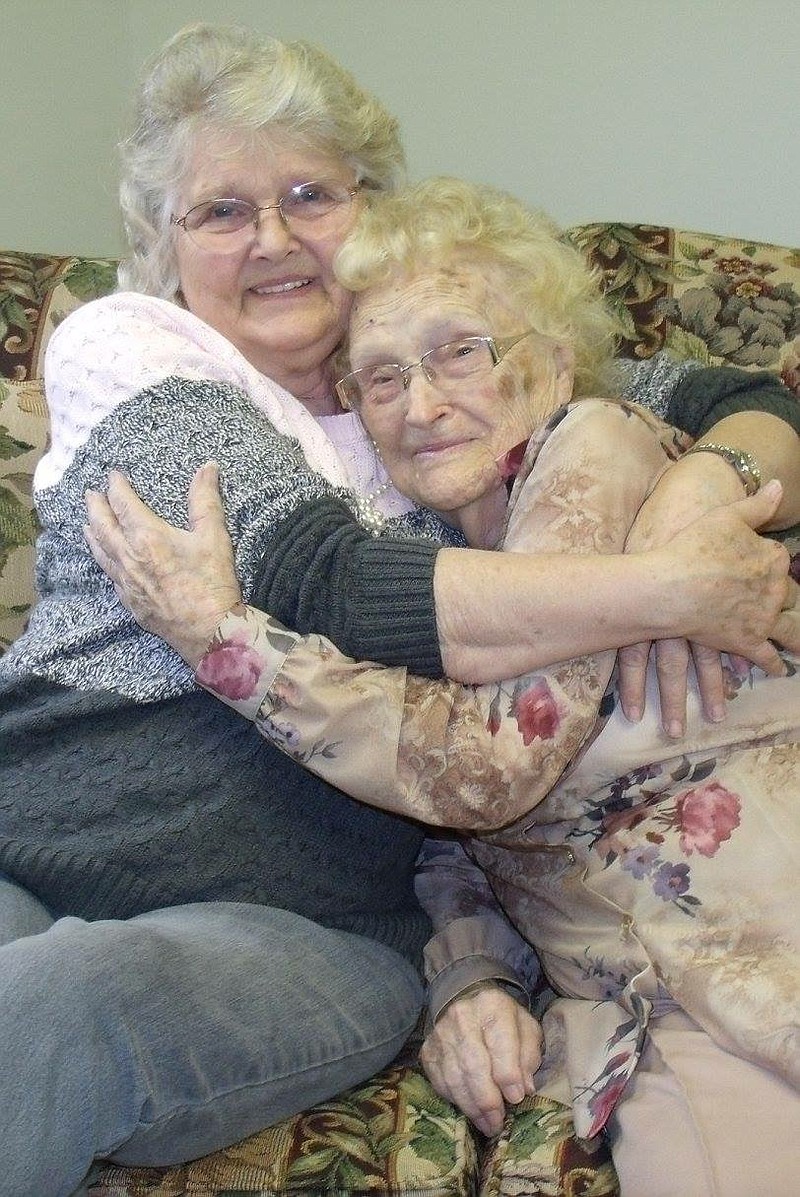 In a Jan. 15, 2016 photo provided by Kimberly Miccio, Betty Morrell, left, and her birthmother, Lena Pierce, 96, are reunited at the Greater Binghamton Airport in  Binghamton, N.Y. Morrell had searched for 50 years for Pierce, who at age 13 was forced to give up the baby she had named Eva May. (Kimberly Miccio via AP)