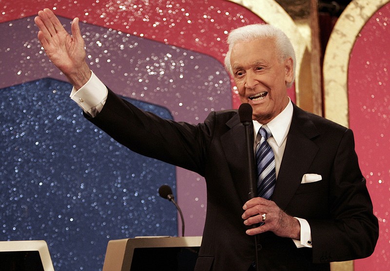 In this June 6, 2007 file photo, legendary game show host Bob Barker waves goodbye as he tapes his final episode of "The Price Is Right" in Los Angeles. Barker will return to a Texas military installation where he became a Navy fighter pilot to help celebrate its 75th anniversary. Naval Air Station Corpus Christi announced the 92-year-old Barker will be the guest speaker at its March 12, 2016, celebration.