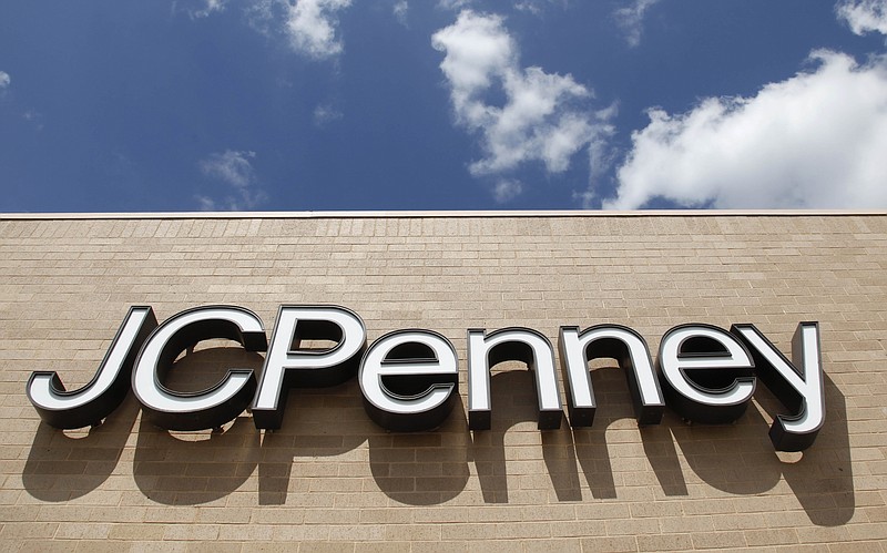  In this June 19, 2012 file photo, a sign at a JC Penney store is pictured in Oklahoma City. J.C. Penney is looking to potentially sell and partially leaseback its headquarters to help lower debt and create long-term savings. The department store operator said Friday, Feb. 5, 2016 that it has a surplus of square footage available in the Plano, Texas office building, with favorable market conditions making it a good time for such a real estate transaction. 