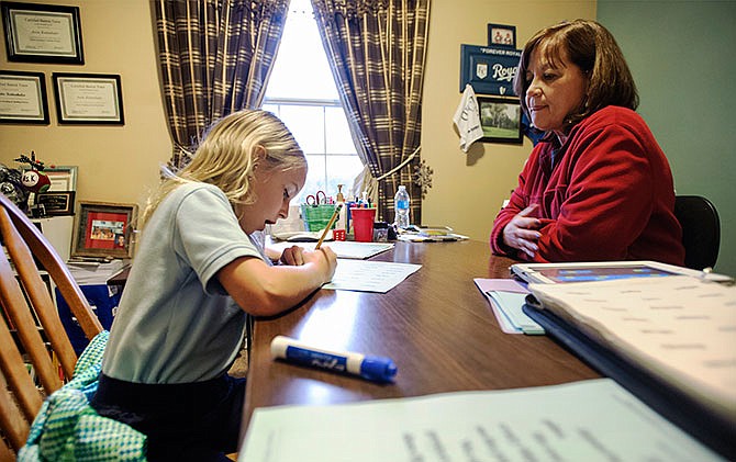 St. Peter first-grader Emmie Patek, left, phonetically breaks down words listed on her worksheet during a recent session with her dyslexia tutor Anita Kuttenkuler. Kuttenkuler is a Master Certified Barton tutor and owner of A New Beginning Dyslexia Center.