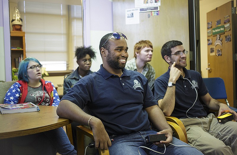 LU Academic Club team captain Anwaar Morales, center, smiles after getting a question correct during a team practice in the Lincoln University Fine Arts Center. Other team member, from left behind Morales,  Ali Swanson, Cameron Forrest, William Frawley and Maher Akremi participate in a practice last week.