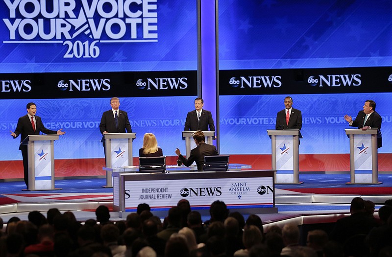 Republican presidential candidate, Sen. Marco Rubio, R-Fla., left, spars with Republican presidential candidate, New Jersey Gov. Chris Christie, right as Republican presidential candidate, businessman Donald Trump, Republican presidential candidate, Sen. Ted Cruz, R-Texas, and Republican presidential candidate, retired neurosurgeon Ben Carson  listen during a Republican presidential primary debate Saturday.