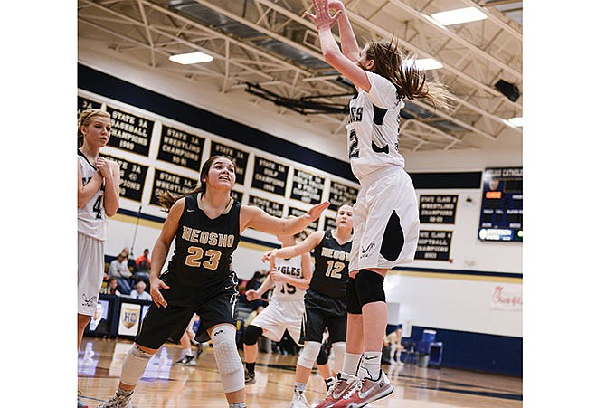 Lexi Dickerson of Eugene pulls up for a 3-pointer as Sydney Linny of Neosho defends Saturday afternoon during the Central Bank Shootout at Rackers Fieldhouse.