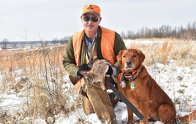 Jim Low proudly displays one of the rabbits he took on a beautiful winter day in north Missouri.