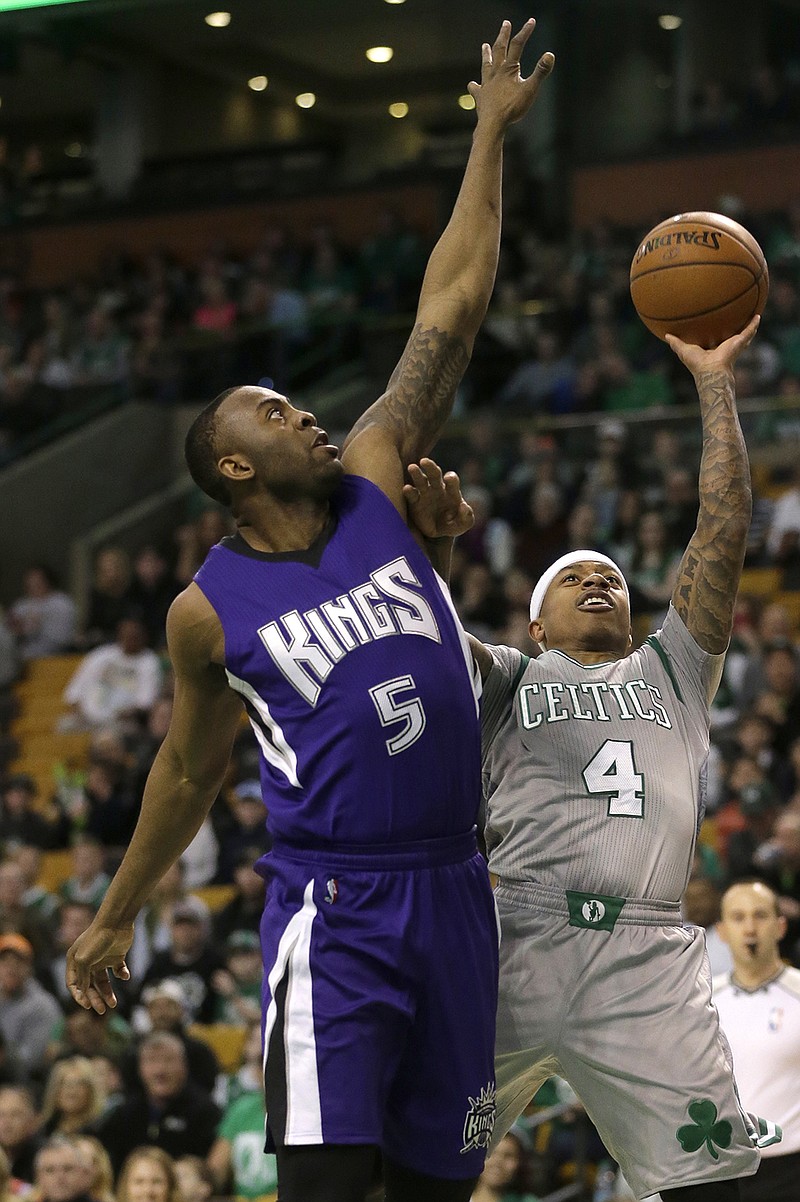 Sacramento Kings guard James Anderson (5) tries to block Boston Celtics guard Isaiah Thomas (4) as he drives toward the basket in the first quarter of an NBA basketball game, Sunday, Feb. 7, 2016, in Boston. 