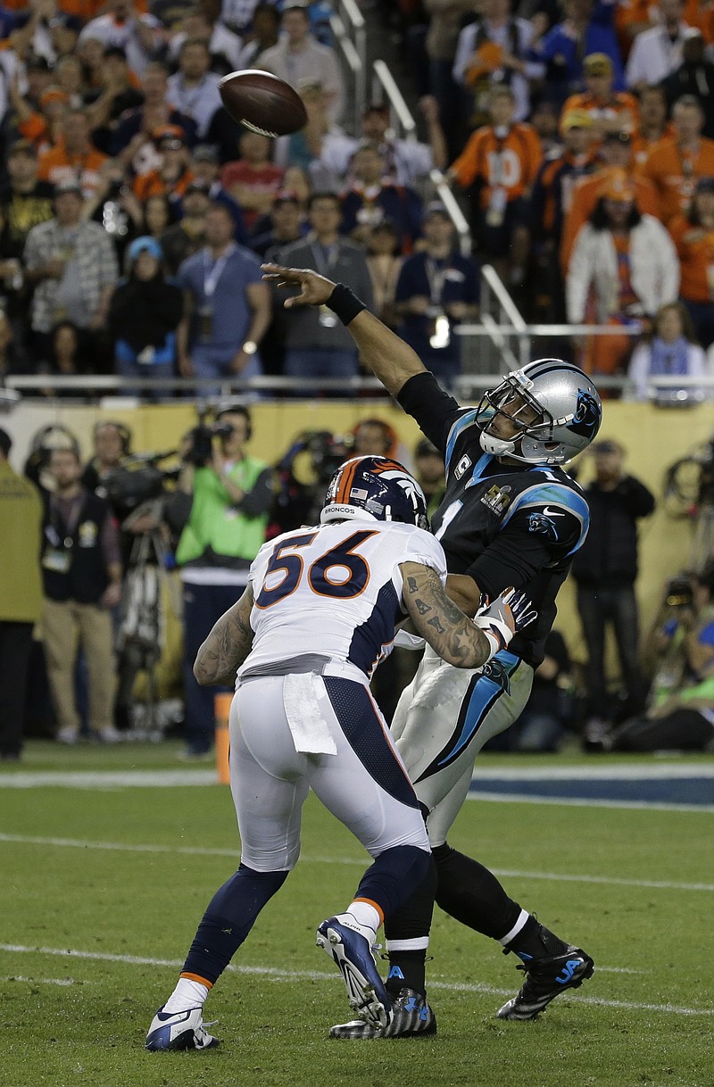 Carolina Panthers' Cam Newton (1) throws with Denver Broncos' Shane Ray (56) rushing during the second half of the NFL Super Bowl 50 football game Sunday, Feb. 7, 2016, in Santa Clara, Calif.
