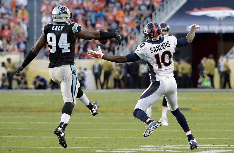 Carolina Panthers' Kony Ealy (94) intercepts a pass intended for Denver Broncos' Emmanuel Sanders (10) during the first half of the NFL Super Bowl 50 football game Sunday, Feb. 7, 2016, in Santa Clara, Calif. 