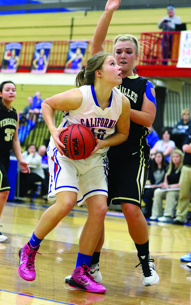 Cameron Meyer of California works against Maddy Hibdon of Versailles during Monday night's game at California. 