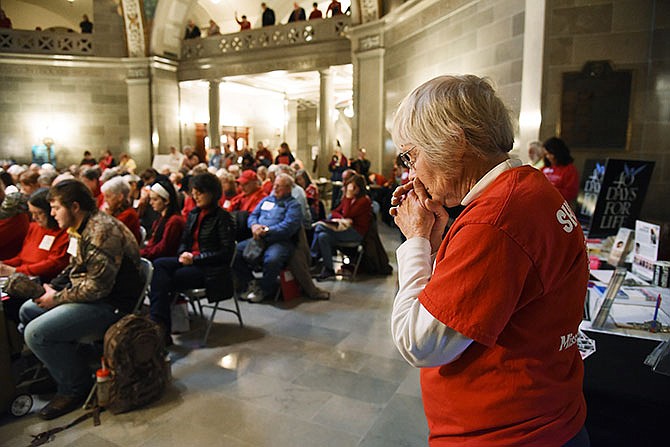 Sue Wortmann closes her eyes and bows her head at the closing prayer at the Missouri Right to Life's "Show Me Life" gathering in Jefferson City. Wortmann is from northeast Missouri and was one of about 200 people who attended a rally in support of pro life causes and legislation.