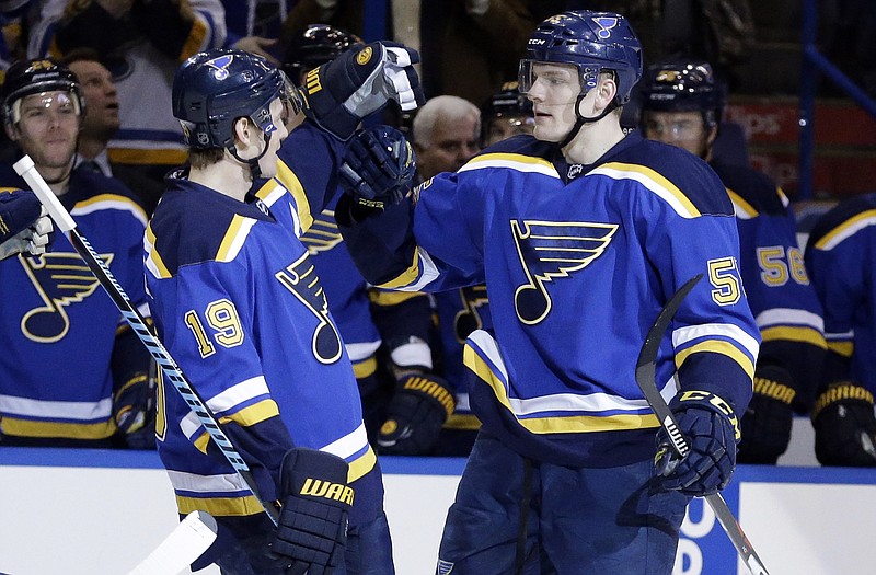 Colton Parayko (right) is congratulated by Blues teammate Jay Bouwmeester after scoring during the second period of Tuesday night's game against the Jets in St. Louis.