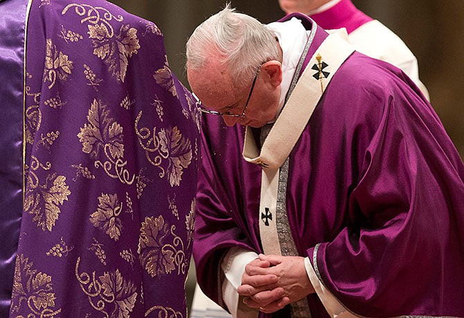 Pope Francis receives the ashes during the Ash Wednesday mass, in St. Peter's Basilica at the Vatican, Wednesday, Feb. 10, 2016. Pope Francis has smudged ashes on the bowed heads of prelates, nuns and ordinary Catholics during Ash Wednesday Mass in St. Peter's Basilica. The ritual marks the start of Lent, a period of penitence, prayer and self-sacrifice as faithful prepare for Easter.