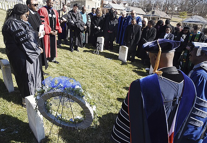 After the annual Founders' Convocation at Lincoln University, a number of faculty and honored guests attended a wreath-laying ceremony Thursday at the gravesite of Pvt. Logan Bennett at National Cemetery.