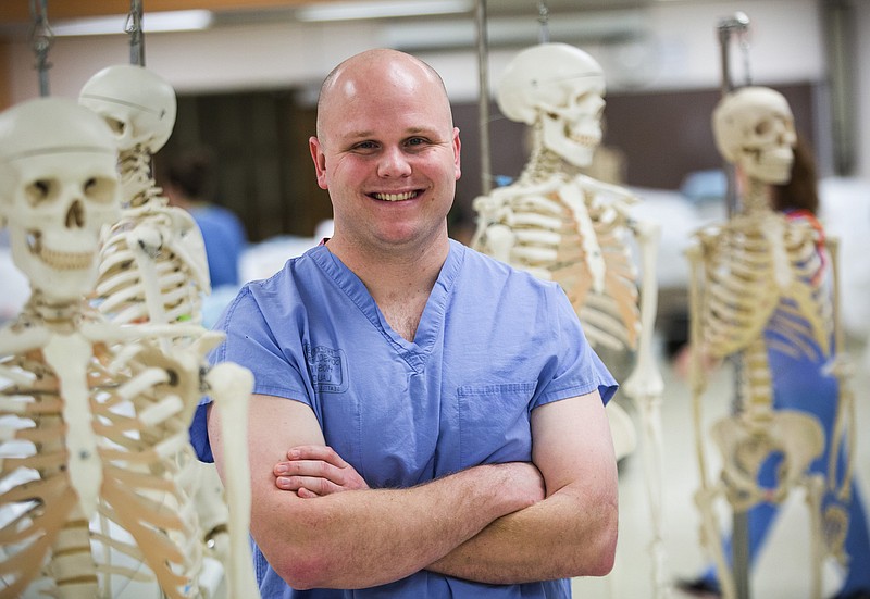First-year medical student Timothy Woodiwiss, shown in an anatomy lab at the University of Washington, has come a long way since he was a 16-year-old high-school dropout. He is among 34 students being honored for achievements in which community college played a part. "You take one step at a time. You never realize how it all added up," he said.