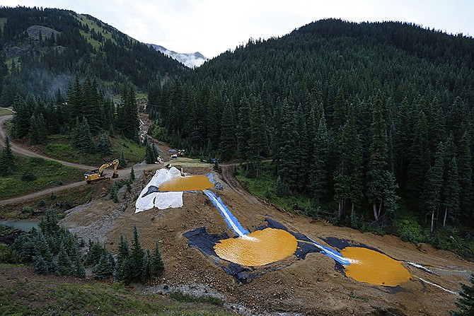 In August 2012, water flows through a series of retention ponds built to contain and filter out heavy metals and chemicals from the Gold King mine chemical accident, in the spillway about 1/4 mile downstream from the mine, outside Silverton, Colorado. 