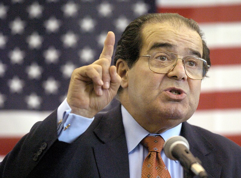 In this Wednesday, April 7, 2004 file photo, U.S. Supreme Court Justice Antonin Scalia speaks to Presbyterian Christian High School students in Hattiesburg, Miss. On Saturday, Feb. 13, 2016, the U.S. Marshall's Service confirmed that Scalia has died at the age of 79.