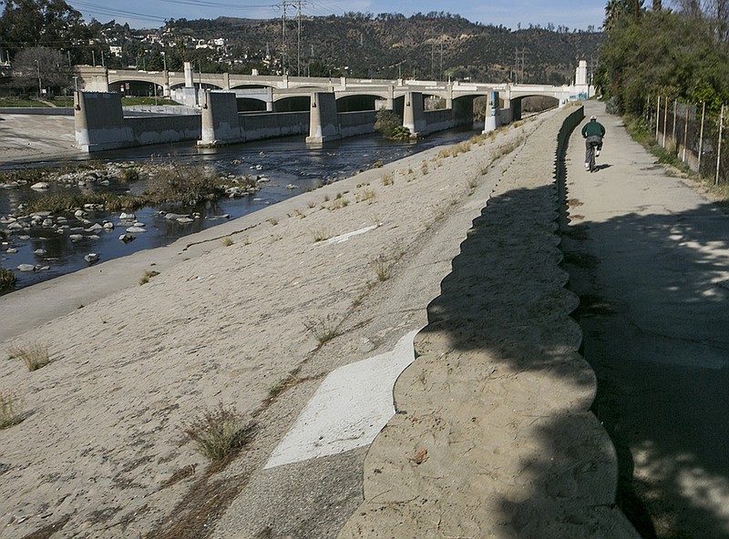 A cyclist rides along recently installed temporary flood control walls along the L.A. River in Los Angeles Friday, Feb. 12, 2016. The US Army Corps of Engineers installed about three miles of temporary barriers along the river through Griffith Park, Atwater Village, and Silver Lake, to increase the amount of water the river can hold during El Nino season. Where did El Nino go? Ten days with record heat and no rain have Californians worrying about the drought again. The dry spell came after a strong El Nino dropped near-normal rain and snow this winter, raising hopes that four years of record dry conditions might be over.