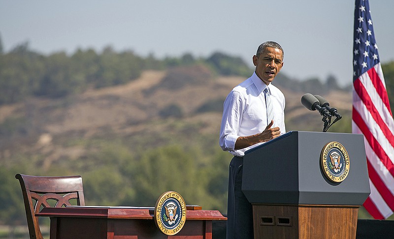 In this Oct. 10, 2014 ,file photo, President Barack Obama speaks at Frank G. Bonelli Regional Park in San Dimas, Calif., as he designated the nearly 350,000 acres within the San Gabriel Mountains northeast of Los Angeles a national monument. Obama is granting national monument status to nearly 1.8 million acres of scenic California desert wilderness, a move the White House says will set it aside in perpetuity for hikers, campers and hunters as well as protect the region's fragile ecosystem and natural resources. Obama, in California this week for a fund-raising swing, plan to make the announcement Friday, Feb. 12, 2016. In all, Obama will name three specific regions national monuments Mojave Trails, Castle Mountains (both in the Mojave Desert) and Sand to Snow in the Sonoran Desert. 