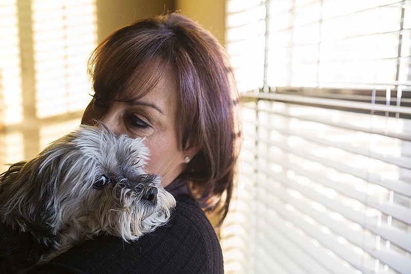 Vicki Hawkins holds her dog, Mow Mouse, a 12-year-old Havanese, Jan. 28, 2016 at her home. Mow Mouse has liver failure and will die soon. Hawkins is in the process of starting Texarkana's only pet crematory. She hopes it will be open in time for Mow Mouse.