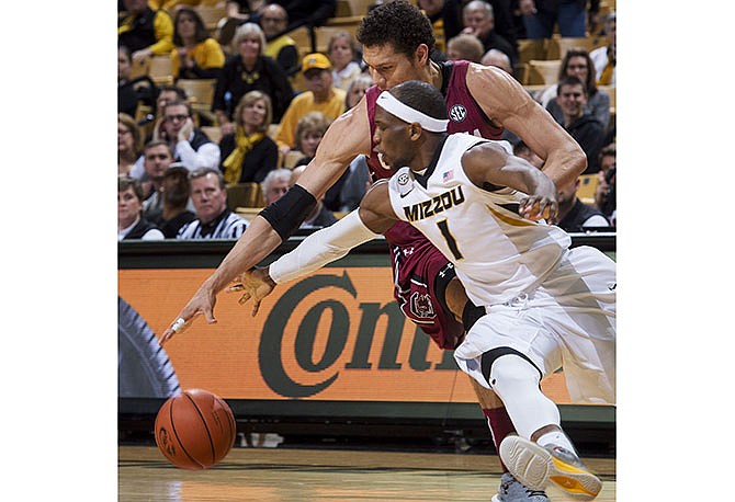 Missouri's Terrence Phillips (1) tries to steal the ball away from South Carolina's Michael Carrera during the second half of an NCAA college basketball game, Tuesday, Feb. 16, 2016, in Columbia, Mo. Missouri won the game 72-67.