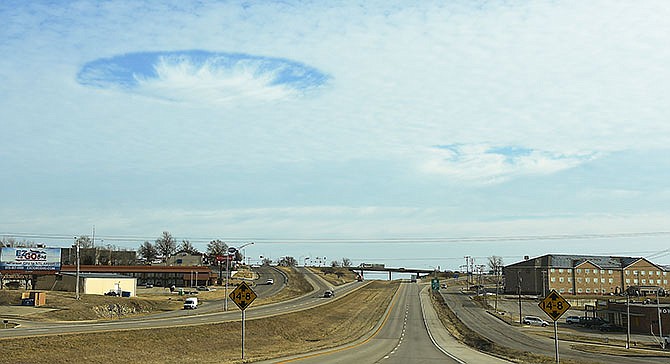Cole and Callaway County residents were among Mid-Missourians looking up on Thursday morning to see a hole in the cloud cover, known as a fallstreak hole or hole punch cloud. This photo of the sky taken on U.S. 54 in Jefferson City looks northward.