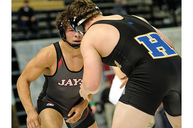 Jefferson City's Jalen Martin (left) wrestles Francis Howell's Jack Heese in the Class 4 195-pound third-place match Saturday in Columbia.